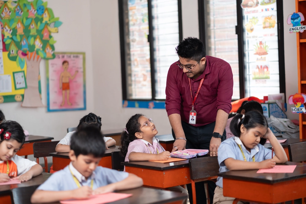 Teacher helping student